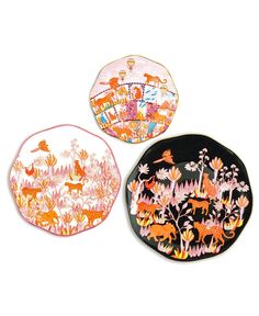 three decorative plates with animals on them