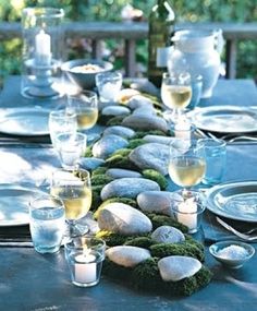 a long table with plates and glasses on it