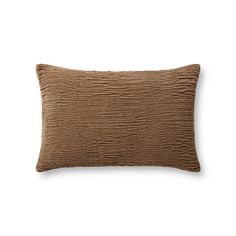 a brown pillow on a white background