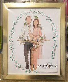 a couple standing next to each other in front of a gold frame