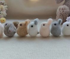 small stuffed animals are lined up in a row