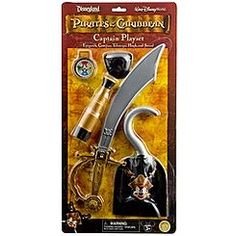 a toy set with a knife and keychain in the shape of a pirate's