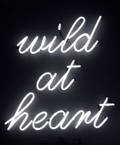 a neon sign that says wild at heart