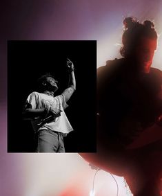 a black and white photo of a man playing an electric guitar