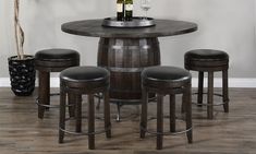 a round table with four stools around it