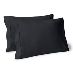 two black pillow cases sitting next to each other