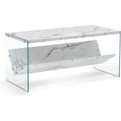 a white marble and glass coffee table with an open shelf on the bottom that holds a magazine