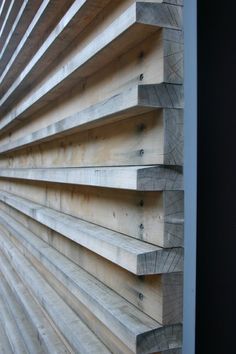 the side of a building with wooden slats on it