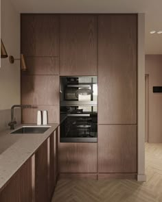 a kitchen with wooden cabinets and an oven in the center, along with a sink