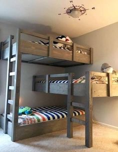 there is a bunk bed with two sets of ladders on the top and bottom