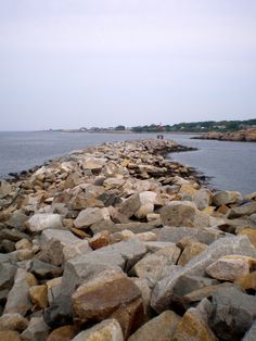 the rocks are lined up along the water's edge, and there is no image here to provide a caption for