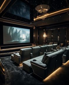 a home theater with two recliners and a projector screen