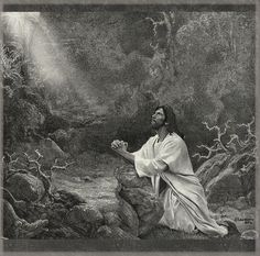 jesus sitting on a rock with his hands clasped