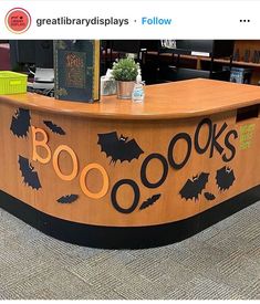 an image of a book store counter with bats on the front and words boo's written on it