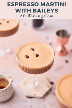 two desserts on a table with chocolate chips and coffee in the cups next to them