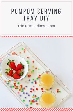 two glasses of orange juice and strawberries on a tray with the words pompom serving tray diy