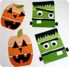 four pieces of paper cut out to look like halloween pumpkins with faces and mouths