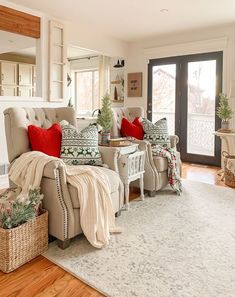 a living room filled with furniture and a fire place in front of a door that leads to a patio