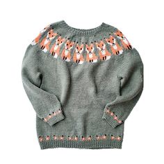 a gray sweater with orange and white designs on it