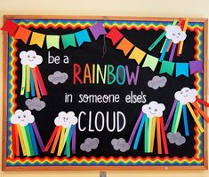 a bulletin board with the words be a rainbow in someone else's cloud