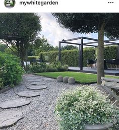 a garden with stepping stones in the middle