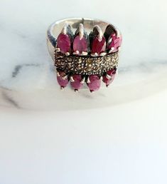 Vintage ruby ring,statement ring,gemstone ring,silver old ring,size 7US,gift for her,unique gift,ruby jewellery,red gemstone Size:7 US This handcrafted ruby vintage ring is stunning. The ring is vintage and used missing some crystals, however the main ruby stones are well secured and looks amazing. The metal for the ring is stamped 925 silver. Makes a perfect gift for a vintage jewelry lover, or a sparkle for your own collection. Elegant Open Ring Jewelry With Stones, Ruby Open Promise Ring, Fine Jewelry Crystal Open Ring With Stone Setting, Fine Jewelry With Ruby And Accent Stones, Fine Jewelry Ruby With Accent Stones, Ruby Rings With Accent Stones And Open Ring Shape, Open Ring With Ruby And Accent Stones, Ruby Jewelry With Stone Setting As Gift, Silver Ruby Jewelry With Stones