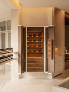 an empty wine cellar with many bottles in it