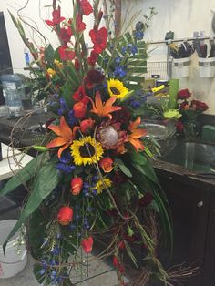 a bouquet of flowers is sitting on the counter