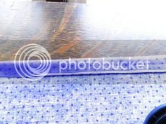 a close up view of the back end of a blue and white table with a logo on it