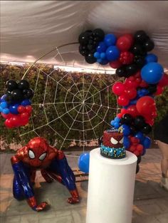 a spiderman themed birthday party with balloons