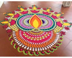 a colorful rangdi design on the floor