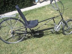 an old bicycle is parked in the grass