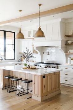 Learn about cozy color schemes for your farmhouse kitchen that enhance the overall aesthetic. 🌟🏡 Wood Color Island In White Kitchen, Kitchen With Natural Wood, Kitchen Aestethic, White Kitchen With Color Island, Guest House Kitchen, Neutral Cozy Kitchen, Country Modern Kitchen Farmhouse Style, Kitchen Mixed Cabinets, Modern Boho Farmhouse Kitchen