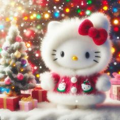 a hello kitty doll next to a christmas tree