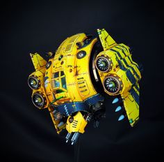 a yellow and black model of a space ship