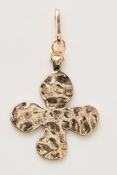 Just as versatile as it is vintage-inspired, this totally timeless bag charm is featured in the sweetest clover silhouette and hammered metal fabrication for a true lived-in look. | Clover Bag Charm by Free People in Gold Timeless Bags, Bag Charms, Hammered Metal, Metal Fabrication, Purse Charms, Birthday Gift Ideas, Boho Clothing, Tech Accessories, Vintage Inspired