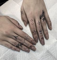 two people with matching tattoos on their hands