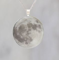 "Science is beautiful - and now you can wear proof of that around your neck!   This pendant features a photo I took of the November 2016 \"Supermoon\" in a silver-plated, lead and nickel free pendant bezel - and it glows in the dark! The \"Supermoon\" is a phenomena when the moon is at it's closest point to the Earth when it is full - and on Nov 13, 2016 it came  closer to Earth while full than it had since 1948.  I created the pendant by taking the printing the photograph on clear plastic backe Moon Shaped Necklace With Large Pendant, Moon Space, 13 November, Super Moon, Satin Bags, The Full Moon, Space Science, How To Make Earrings, Brass Chain