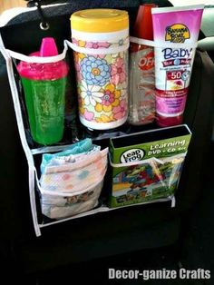 the car seat organizer is filled with baby products and diapers, including sunscreens