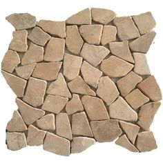 a pile of stone sitting on top of a white floor covered in lots of small rocks