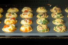 many small pastries are sitting on a baking sheet in the oven and ready to be baked