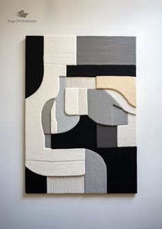 an abstract painting with black, white and grey colors