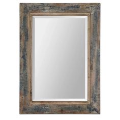 an old wooden frame mirror on a white wall