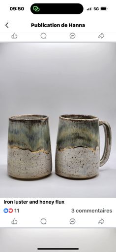 two coffee mugs sitting next to each other