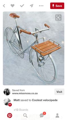 an old fashioned bicycle with a wooden seat and handlebars is parked in the snow