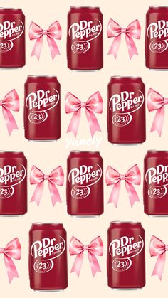 many red soda cans with pink bows on them and the words dr pepper written in white