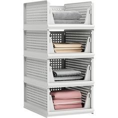 three tiered storage rack with four baskets on each side and folded sheets in the middle