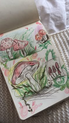 a drawing of two mushrooms on top of a paper