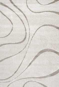 a white rug with wavy lines on it