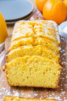 sliced loaf of orange bread sitting on top of a wooden cutting board